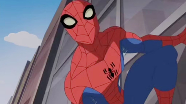 Peter Parker sticks to a building in "The Spectacular Spider-Man."