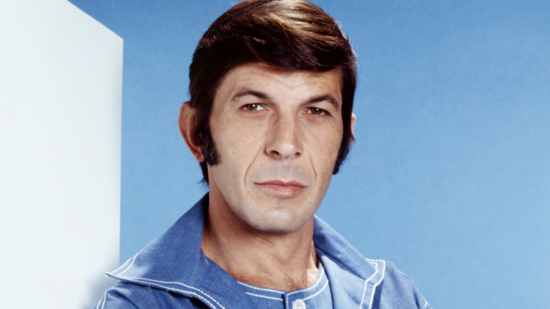 Leonard Nimoy posing by a white wall