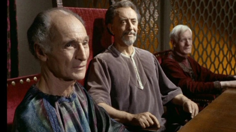 The Organian Council sitting at a table