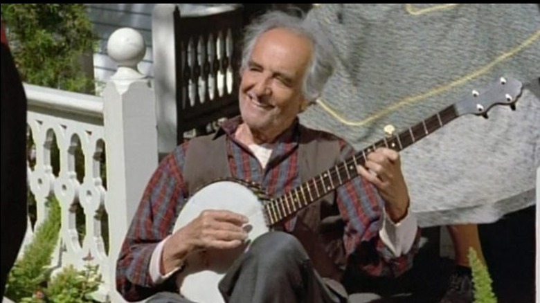 The Caretake playing a banjo