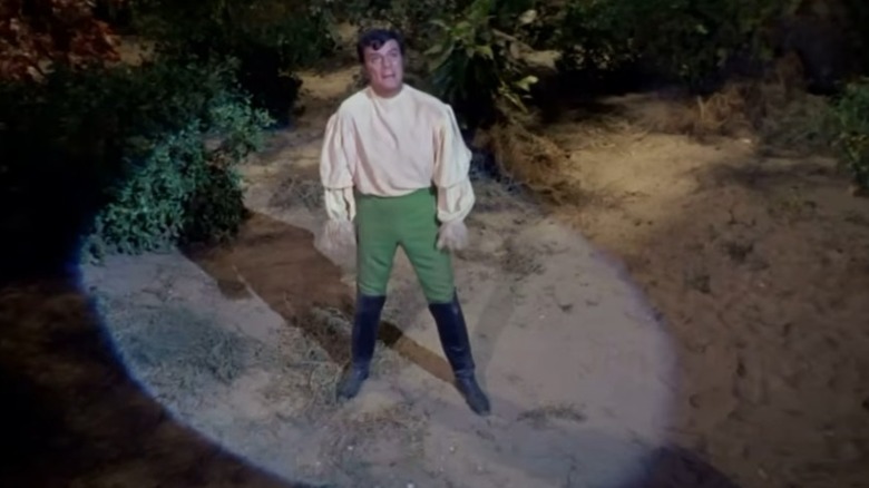 Trelance speaking in a spotlight from "Star Trek: The Original Series"