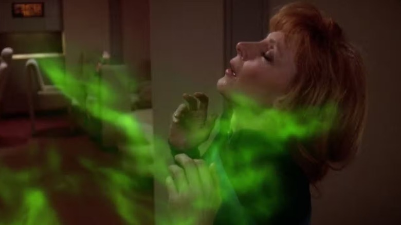 Beverly Crusher (Gates McFadden) reacts sensually to a green ghostly energy in Star Trek: The Next Generation