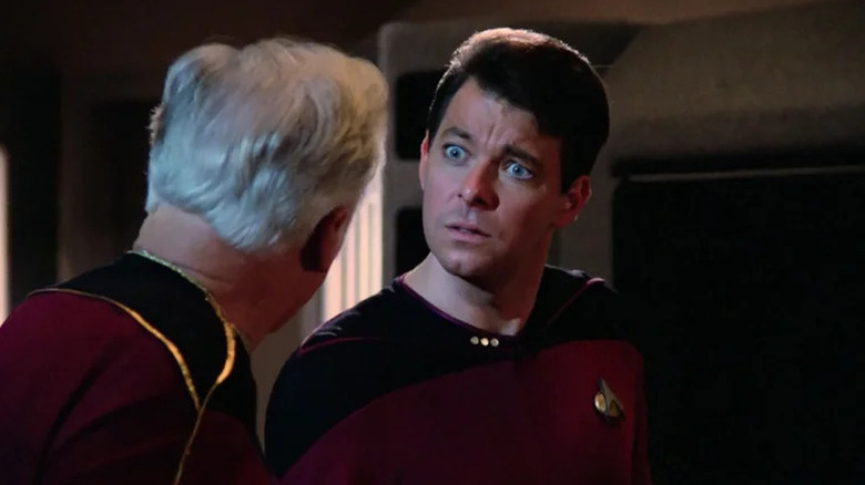 Will Riker (Jonathan Frakes) stares shocked at Gregory Quinn (Ward Costello) in Star Trek: The Next Generation