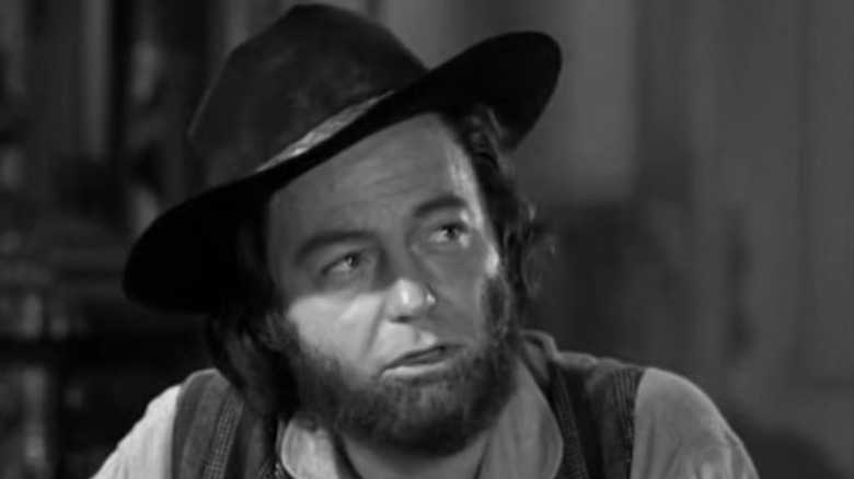 Will Bailey, played by DeForest Kelley, speaks to U.S. Marshal Matt Dillon in a Season 1 episode of Gunsmoke.
