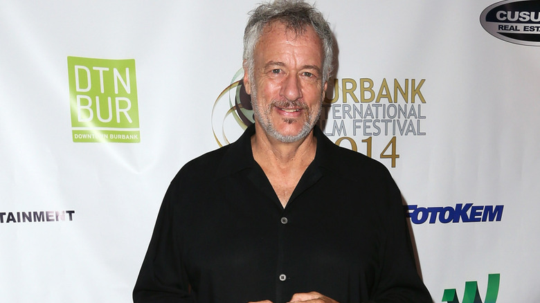 John de Lancie wearing a black shirt
