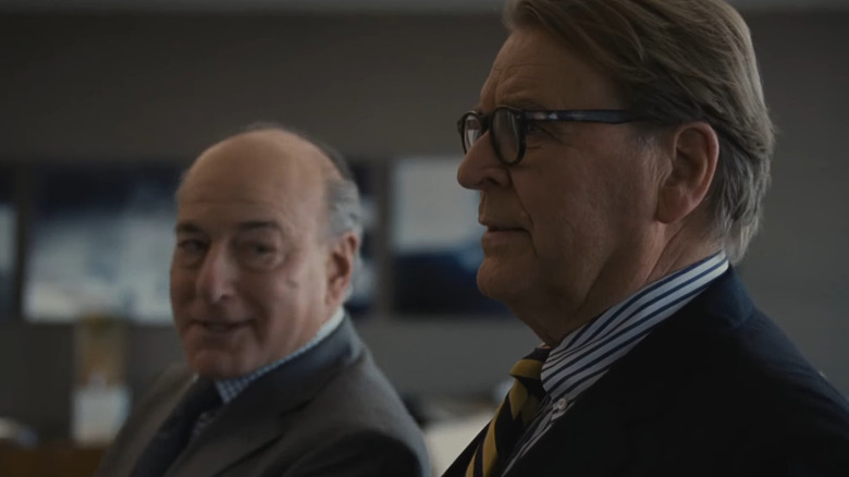 Peter Friedman and David Rasche as Frank Vernon and Karl Muller, talking discreetly to one another on Succession