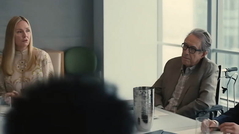 Hope Davis and Larry Pine as Sandi and Sandy Furness, sitting next to each other in the Waystar boardroom on Succession