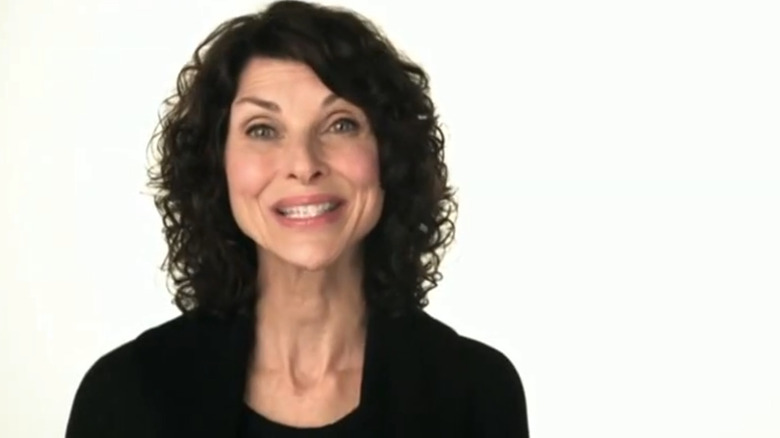 Pam Tebow smiling in focus on the family ad