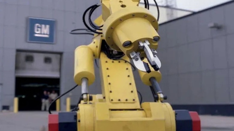 A robot rolls away from the GM factory.