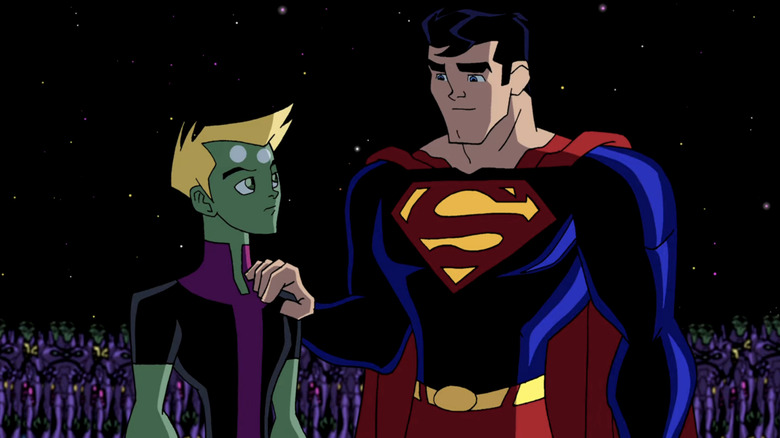 Brainiac 5 and Superman standing in space surrounded by purple robots.