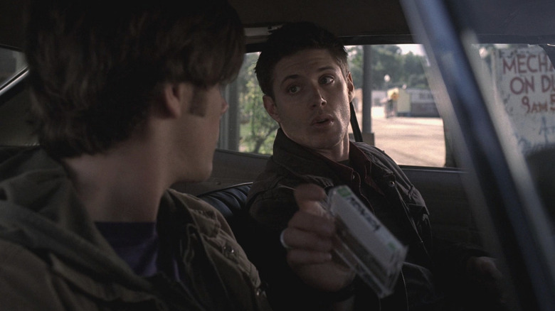 Dean Winchester grabs his cassette tapes from Sam Winchester on Supernatural (2005-2020)