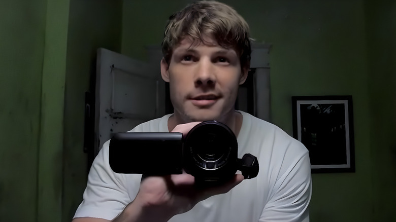 Michael Wheeler (Brandon Jones) holding a camera on "Supernatural."
