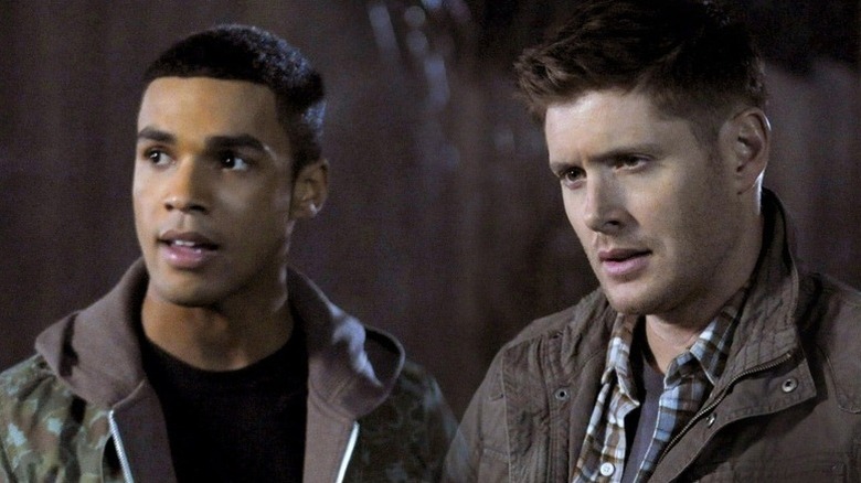 Ennis Ross (Lucien Laviscount) and Dean Winchester (Jensen Ackles) standing next to each other on "Supernatural."