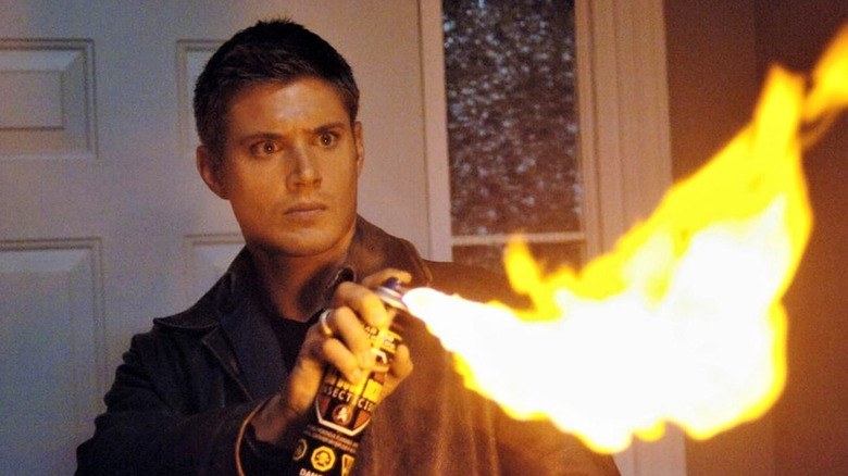 Dean Winchester (Jensen Ackles) spraying flames on "Supernatural."