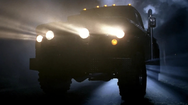 A truck shining its lights on "Supernatural."
