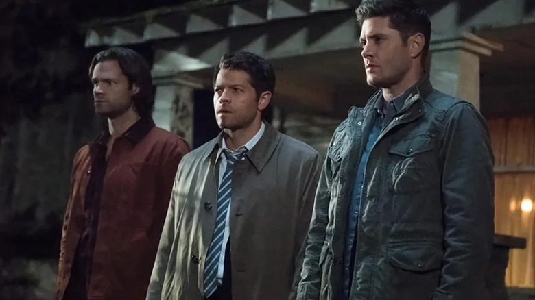 Sam Winchester, Castiel, and Dean Winchester looking nervous on Supernatural (2005-2020)