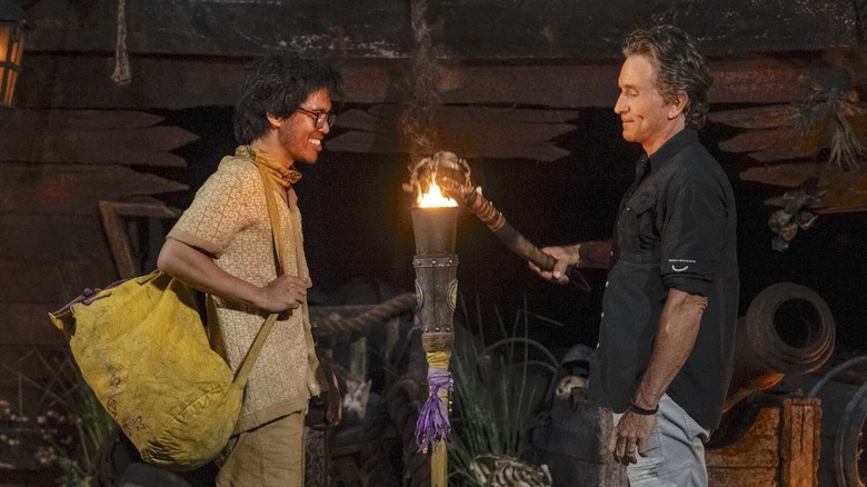 Jason Treul gets his torch snuffed by Jeff Probst on Survivor 49