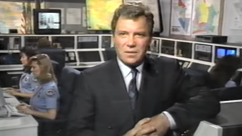 William Shatner wearing a suit in an EMT control room on "Rescue 911" (1989)
