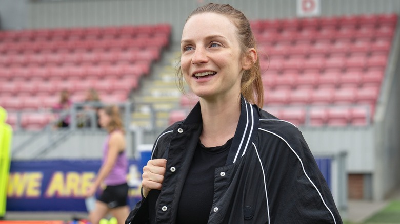 Lizzie smiling and having a conversation