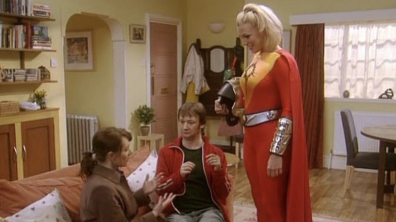Lula/Thermowoman standing, while George and Janet speak