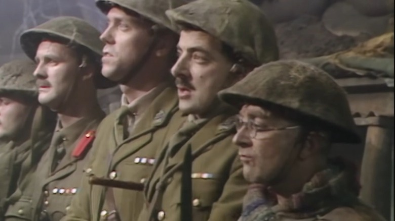 Tim McInnerny as Darling, Hugh Laurie as George, Rowan Atkinson as Blackadder and Tony Robinson as Baldrick prepare for a final, suicidal charge in Blackadder Goes Forth