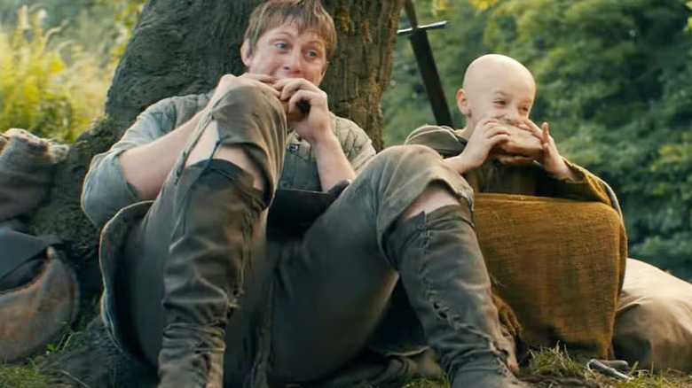 Peter Claffey as "Dunk" and Dexter Sol Ansell as "Egg" share a sandwich in A Knight of the Seven Kingdoms.