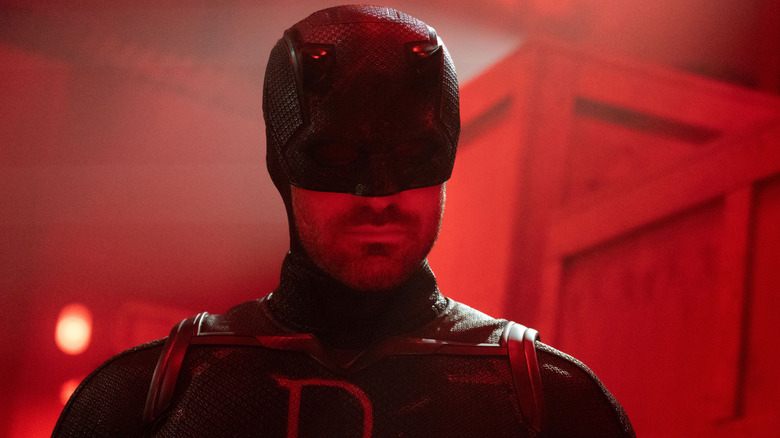 Charlie Cox as Daredevil wearing a black and red costume in Daredevil: Born Again