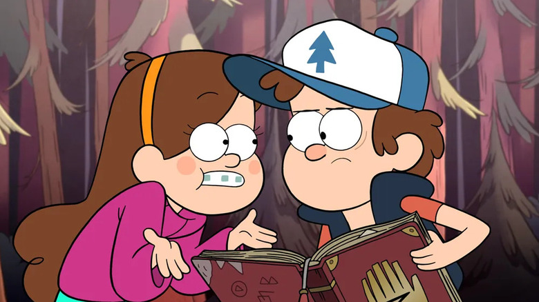 Dipper and Mabel looking at a book on Gravity Falls