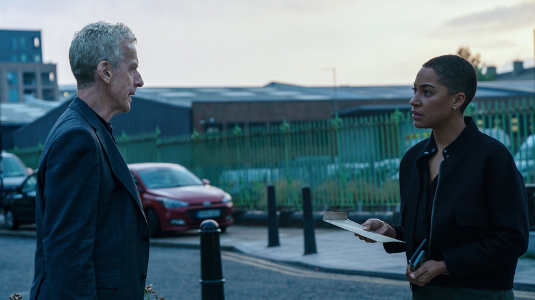 Peter Capaldi's Daniel Hegarty and Cush Jumbo's June Lenker standing face to face on a street on Criminal Record