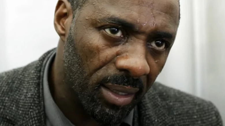 Idris Elba's John Luther with a grey beard and sweaty face on Luther