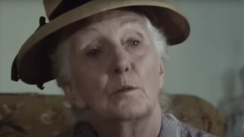 Joan Hickson's Miss Marple wearing a beige hat on Miss Marple
