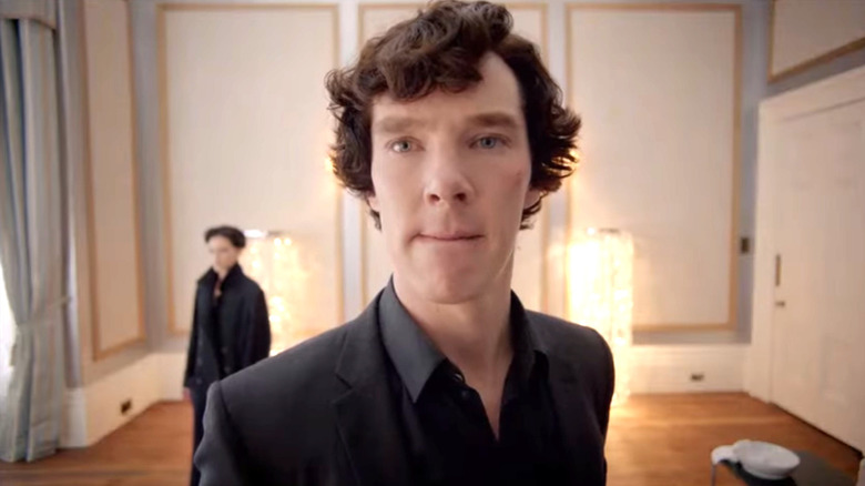Benedict Cumberbatch's Sherlock Holmes wearing a suit and looking thoughtful on Sherlock