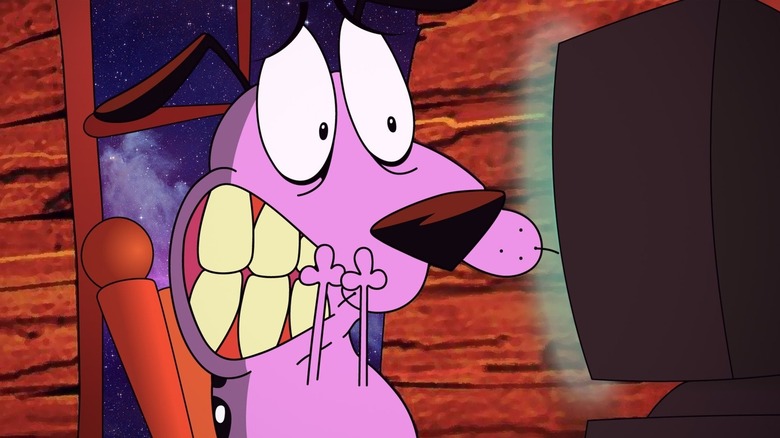 Courage (Marty Grabstein) covers his mouth while watching television in Courage the Cowardly Dog