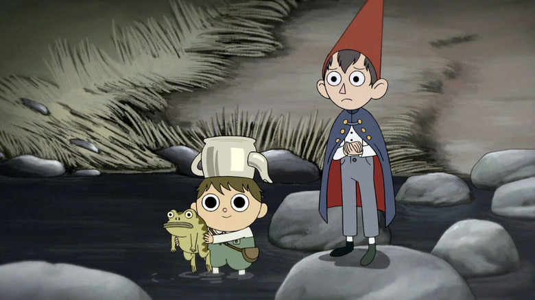 Greg (Collin Dean) and Wirt (Elijah Wood) stand in a creek in Over the Garden Wall