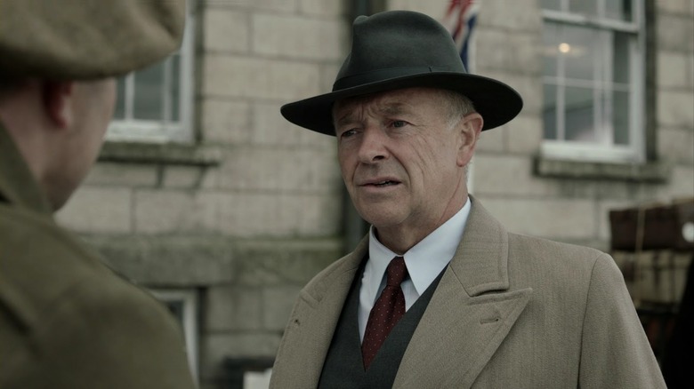 Christopher Foyle (Michael Kitchen) speaks with a British soldier in Foyle's War
