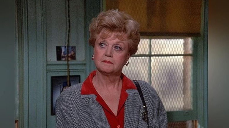 Jessica Fletcher (Angela Lansbury) stands in a dingy room on Murder, She Wrote