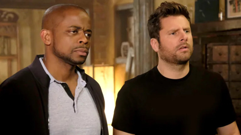 Gus Guster (Dulé Hill) and Shawn Spencer (James Roday Rodriguez) stand side-by-side on Psych