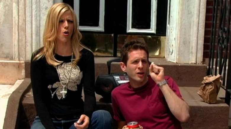 Kaitlin Olson and Glenn Howerton as Dee and Dennis drinking on a stoop on Always Sunny