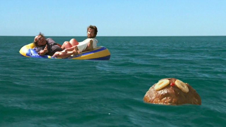 Danny DeVito and Rob Mac as Frank and Mac on a raft looking at Rum Ham in the water in Always Sunny