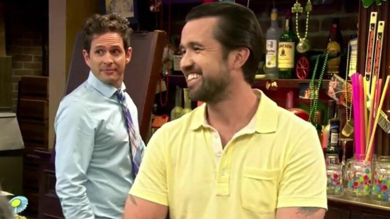 Glenn Howerton and Rob Mac as Dennis and Mac wearing bright clothes in Paddy's Pub on Always Sunny