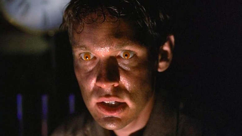 Doug Hutchison as Eugene Tooms with sweaty face and orange eyes as Eugene Tooms in The X-Files