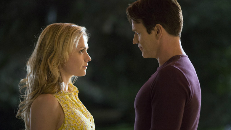 Anna Paquin as Sookie Stackhouse stands in front of Stephen Moyer as Bill Compton in True Blood