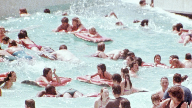 A bunch of swimmers lounge in a tide pool in Class Action Park