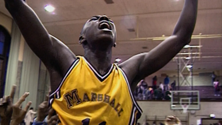 A high school basketball player shouts on the court in Hoop Dreams