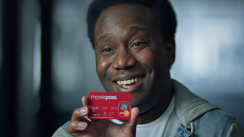 Emmanuel Freeman holds up his MoviePass debit card in MoviePass, MovieCrash