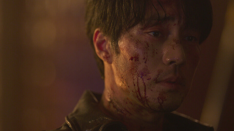 Nam Gi-jun (So Ji-sub) stands forlorn with a bloody face on Mercy for None