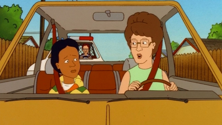 Peggy in a car with Lupe on King of the Hill
