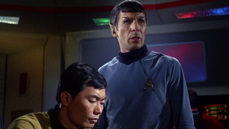 Spock and Sulu consult on a problem