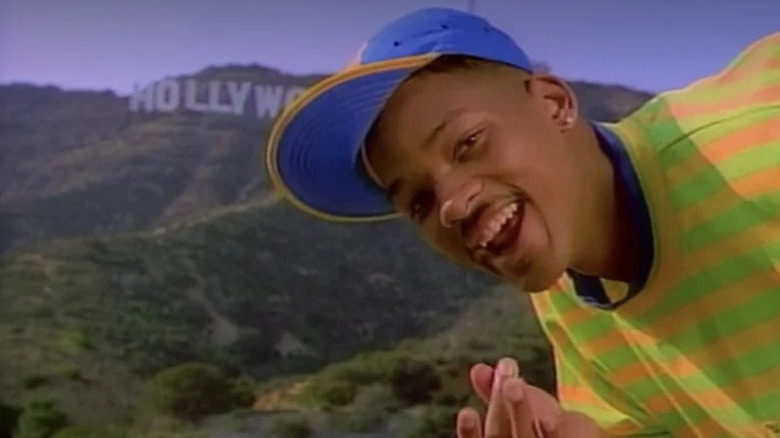 Will smiling in front of the Hollywood sign