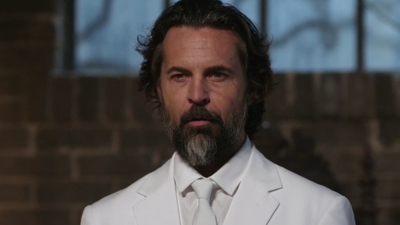 Jeffrey Vincent Parise's Asmodeus wearing an all-white suit on Supernatural